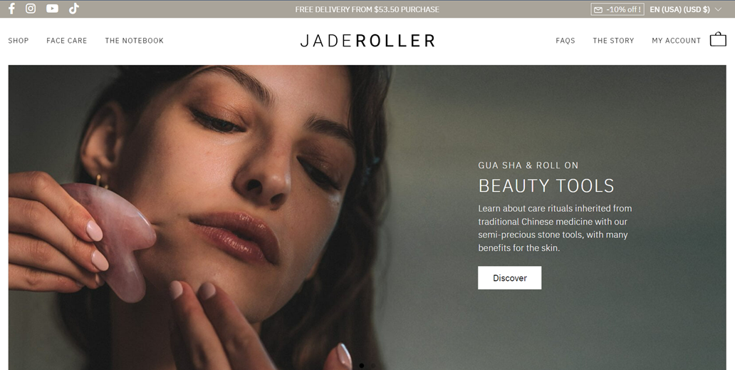 Woman using jade roller on her face. Beauty and skincare routine.