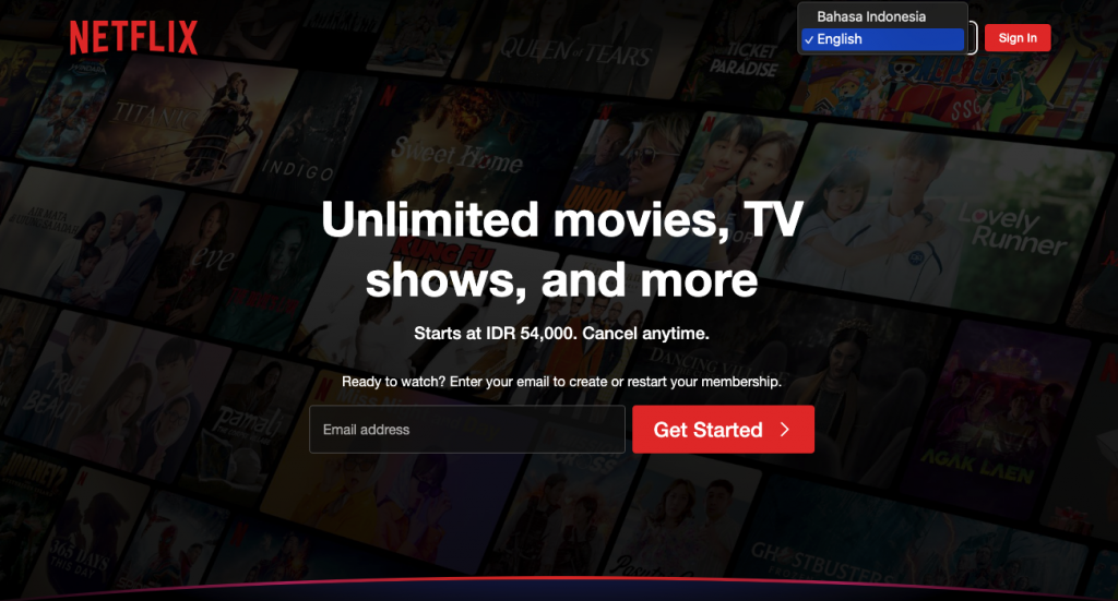 Netflix homepage with various movie and TV show options. Unlimited entertainment available.