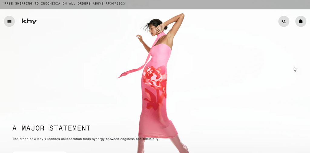 Woman wearing pink dress with floral pattern. Elegant fashion model.