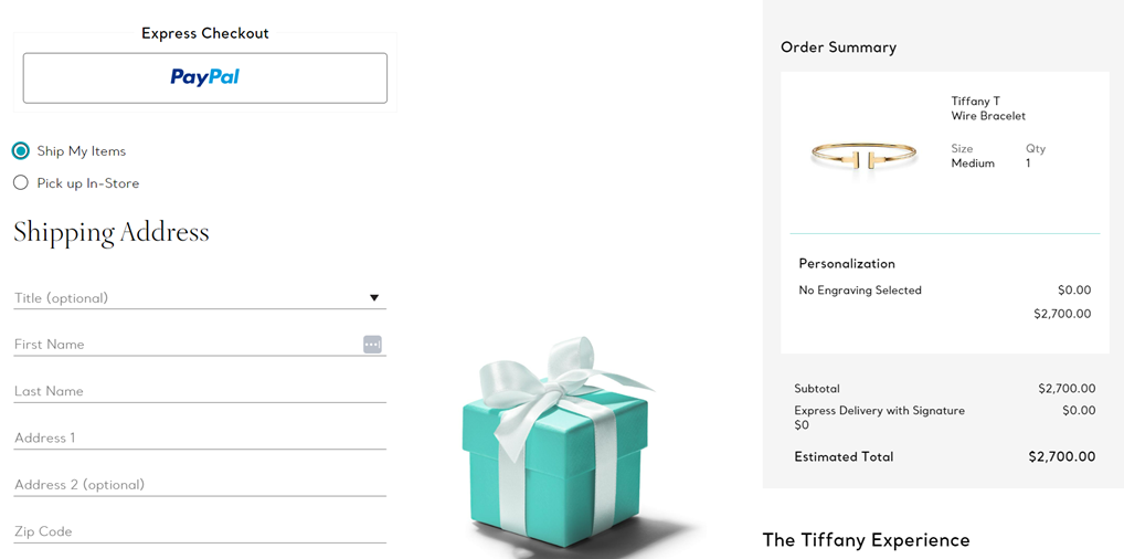 A teal gift box with a white ribbon, next to order summary.