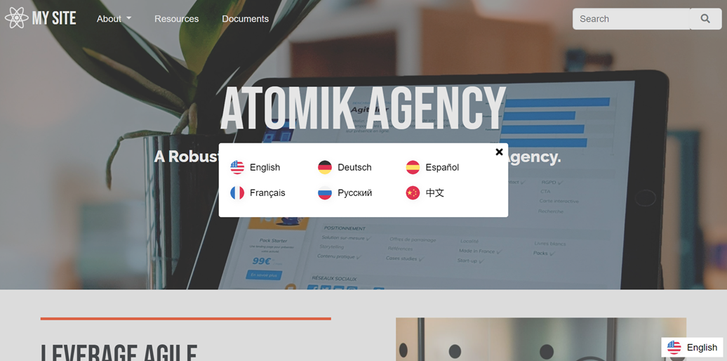 Atomik Agency website homepage with language options