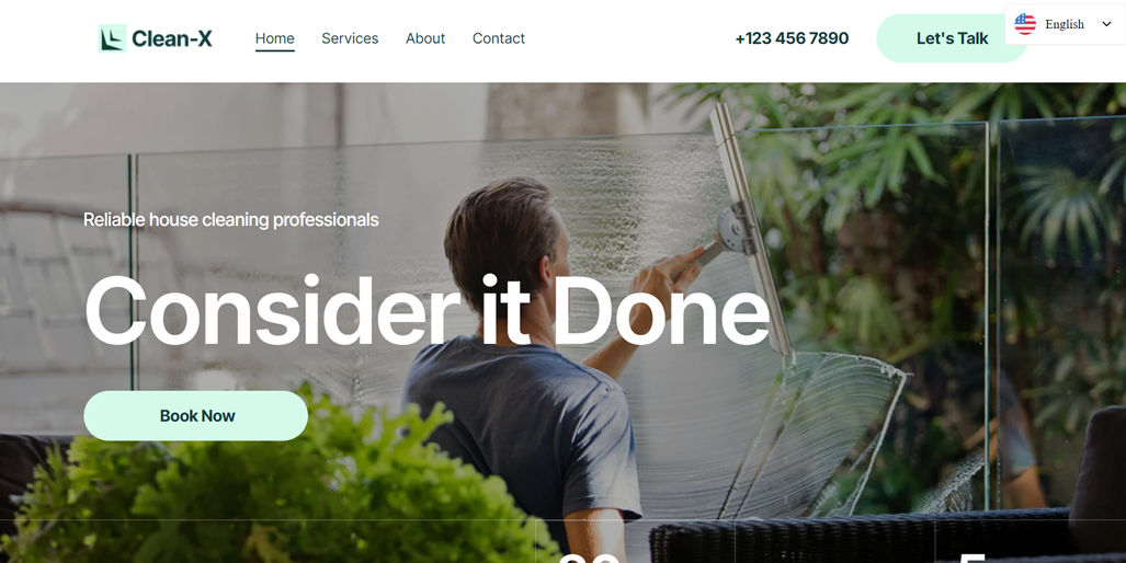 Man cleaning window with squeegee, green plants in background