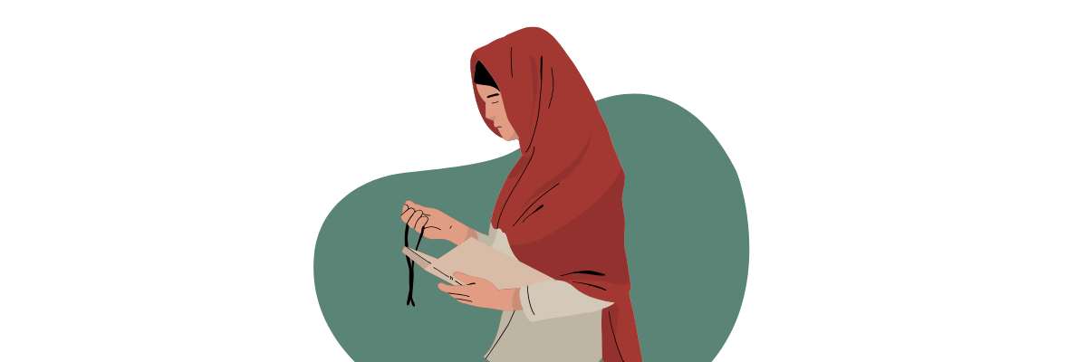 A woman wearing a red hijab. She is holding a rosary.