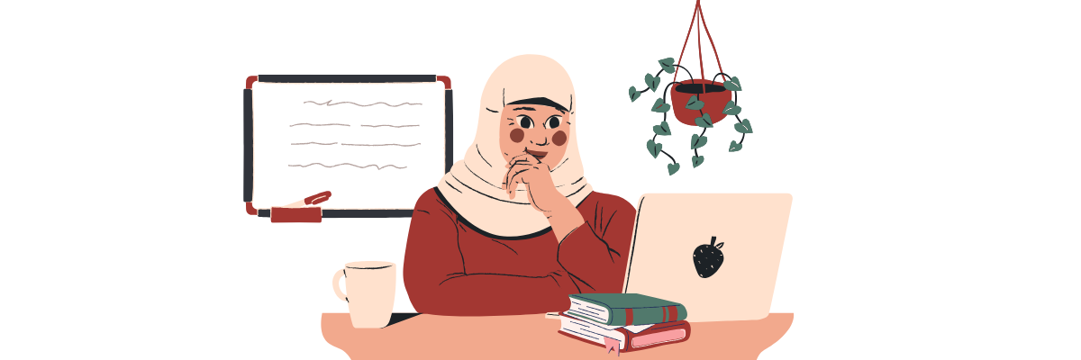 A woman in a hijab sitting with a laptop and books. She appears to be studying.